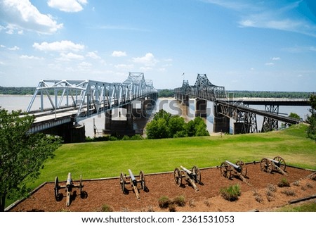 Row of canons display at historic Vicksburg battlefield overlooking old and new bridges across Mississippi River, artillery during siege of Vicksburg civil war, Mississippi, USA. Interstate 20, US 80 Royalty-Free Stock Photo #2361531053
