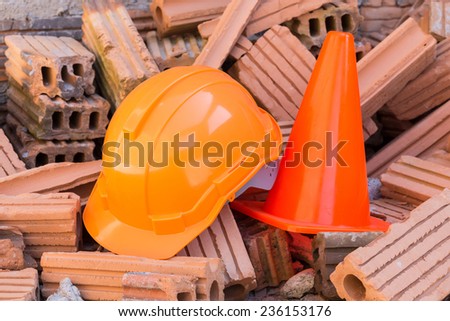 hard hat safety helmet and cone in construction site