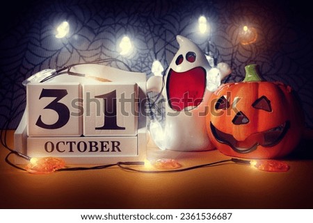 Halloween calendar date 31st October with pumpkin and ghost
