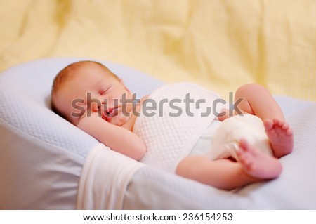 Sweet newborn baby sleeping, closeup portrait