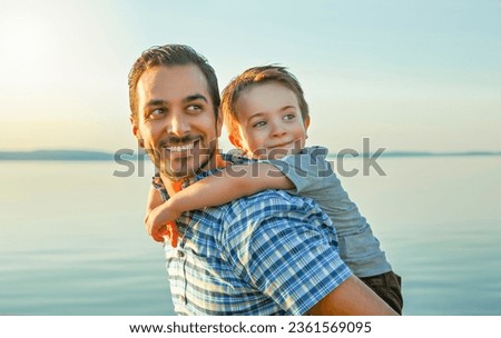 A Father with is son at the sunset Royalty-Free Stock Photo #2361569095