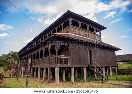 Traditional dayaknese house called "Rumah Panjang" (Long House) in Pulau Kumala, Kutai Kartanegara, East Kalimantan, Indonesia. Royalty-Free Stock Photo #2361585475