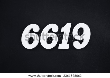 Black for the background. The number 6619 is made of white painted wood.