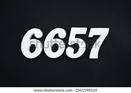 Black for the background. The number 6657 is made of white painted wood.