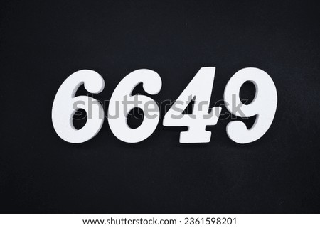 Black for the background. The number 6649 is made of white painted wood.