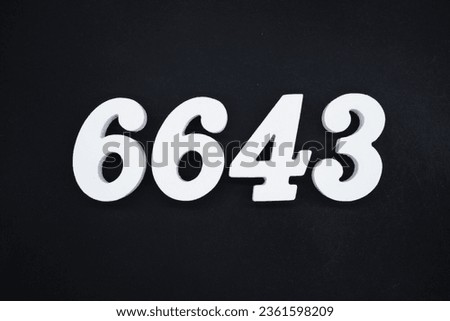 Black for the background. The number 6643 is made of white painted wood.