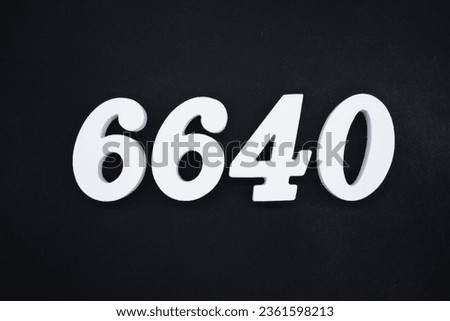 Black for the background. The number 6640 is made of white painted wood.