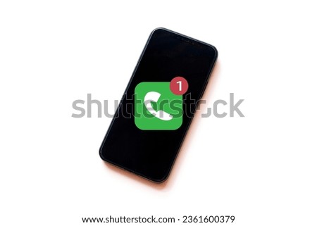 Missed call,notification concept.,Smartphone with missed call notification icon on screen over white background idea for technology,business,communication. Royalty-Free Stock Photo #2361600379