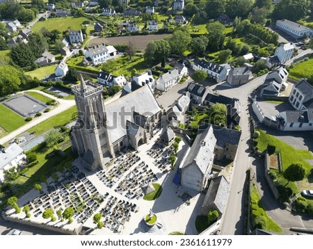 Aerial view of St John the Baptist's christian church, famous for its reliquary finger, Saint-jean-du-doigt, French Brittany. Royalty-Free Stock Photo #2361611979