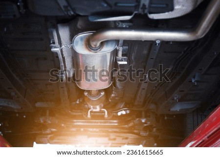 Close-up of catalytic converter in automobile exhaust system. Royalty-Free Stock Photo #2361615665