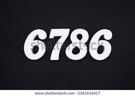Black for the background. The number 6786 is made of white painted wood.