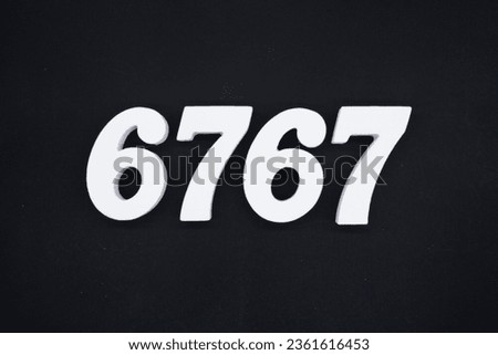 Black for the background. The number 6767 is made of white painted wood.