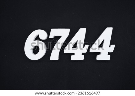 Black for the background. The number 6744 is made of white painted wood.