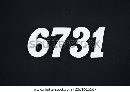 Black for the background. The number 6731 is made of white painted wood.