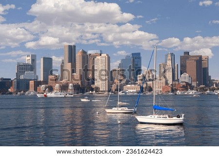 Boston skyline and harbor with boats and Atlantic Ocean on the foreground, USA