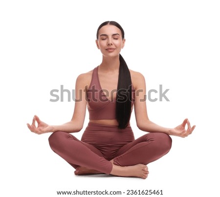 Beautiful young woman practicing yoga on white background. Lotus pose Royalty-Free Stock Photo #2361625461