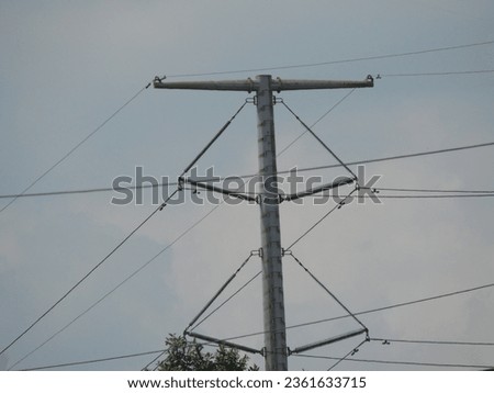 Isolated electric pole with wire (tiang listrik) Royalty-Free Stock Photo #2361633715