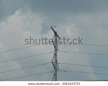 Isolated electric pole with wire (tiang listrik) Royalty-Free Stock Photo #2361633721