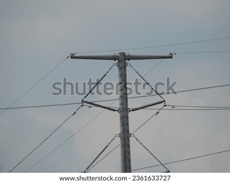 Isolated electric pole with wire (tiang listrik) Royalty-Free Stock Photo #2361633727