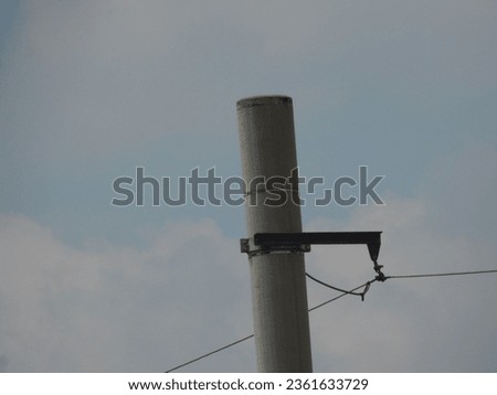 Isolated electric pole with wire (tiang listrik) Royalty-Free Stock Photo #2361633729