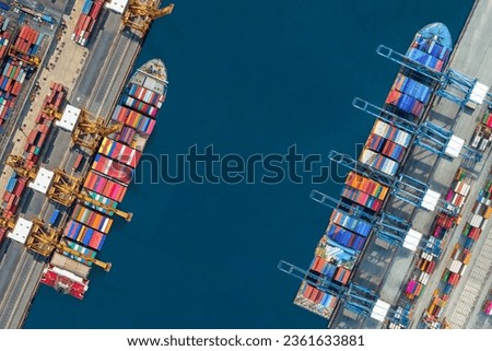 Industrial import-export port prepare to load containers. Aerial top view container ship in export and import global business and logistic. Global transportation and logistic business. Royalty-Free Stock Photo #2361633881