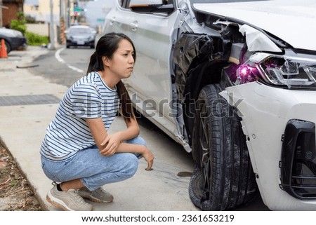 Woman encounter car accident on the road Royalty-Free Stock Photo #2361653219
