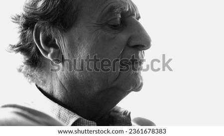 Stressed Caucasian Senior in 70s with Anxious Expression in monochrome - Introspectively Wrestling with Tough Decision, black and white