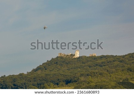 Airplane over a castle ruins