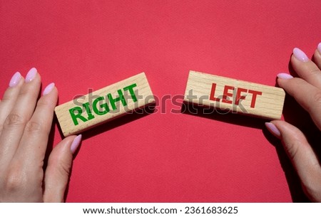 Right or Left symbol. Concept word Right or Left on wooden blocks. Businessman hand. Beautiful red background. Business and Right or Left concept. Copy space