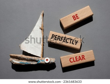 Be perfectly clear symbol. Concept words Be perfectlyclear on wooden blocks. Beautiful grey background with boat. Business and Be perfectly clear concept. Copy space Royalty-Free Stock Photo #2361683633
