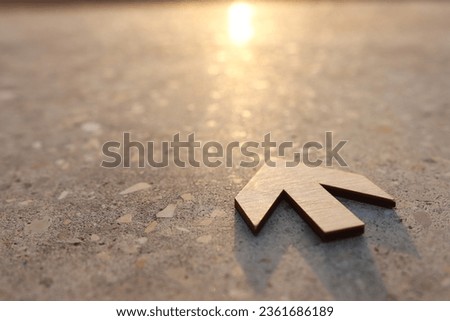 Arrow sign pointing ahead. Concept of challenge and looking forward Royalty-Free Stock Photo #2361686189