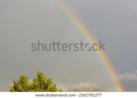 the rainbow over the Attica's sky after a heavy rain fold
