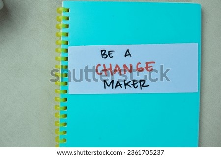 Concept of Be a Change Maker write on sticky notes isolated on Wooden Table.