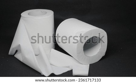 photo of white toilet paper on a black background