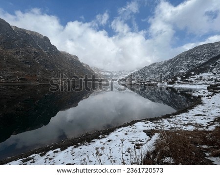 Changu Lake with mountain picture. Snow time at the mountain. 