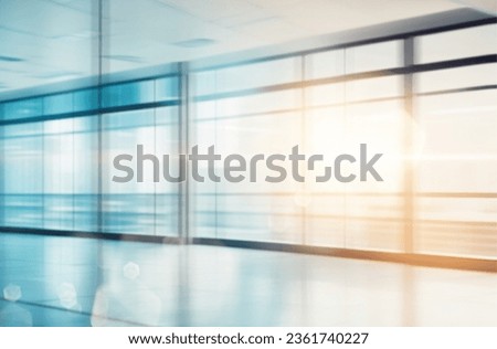 Modern business grey blurred or defocus glass wall from building background with light effect.