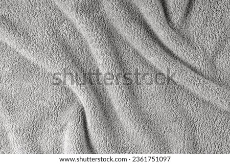  Terry cloth, gray towel texture background. Wrinkled and crumped soft fluffy textile bath or beach towel material. Top view, close up. Royalty-Free Stock Photo #2361751097