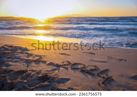 The number 2024 written in the sand on the beach. new year 2024 concept with text on sun rising sky. Creative Concept.  Royalty-Free Stock Photo #2361756575