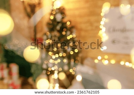 Beautiful holiday decorated room with Christmas tree and bright lights , out of focus shot for photo background. Blur christmas background.