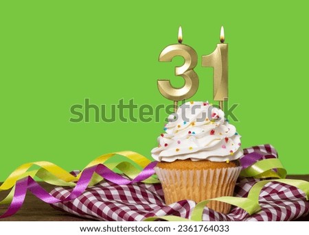 Birthday Cake With Candle Number 31 - On Green Background.
