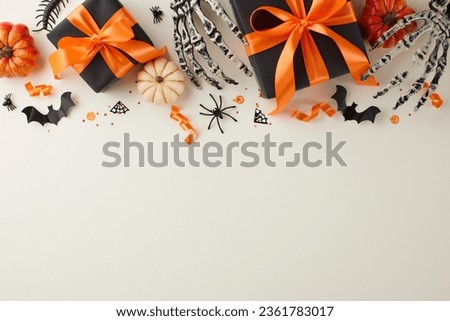 Delighting close friends with unique Halloween gift ideas. Top view photo of skeleton hands, dark presents with ribbons, pumpkins, spooky insects, confetti on light grey background with ad space