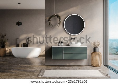 modern bathroom with beige and soil tone walls, white bathtub, green vanity, black mirror, sink, terrazzo floor, and a view of the pool and sea from the window