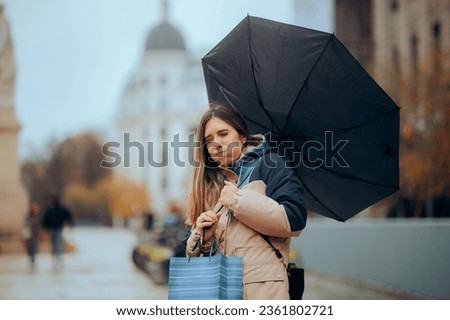 
Stressed Woman Walking in the Rain with Broken Umbrella 
Girl having an accident feeling unlucky in a rainy day
 Royalty-Free Stock Photo #2361802721