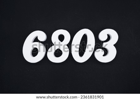 Black for the background. The number 6803 is made of white painted wood.