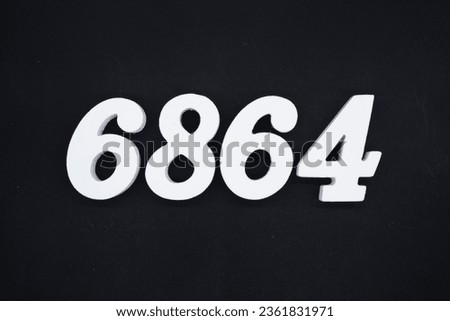 Black for the background. The number 6864 is made of white painted wood.