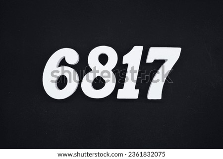 Black for the background. The number 6817 is made of white painted wood.