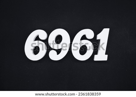 Black for the background. The number 6961 is made of white painted wood.