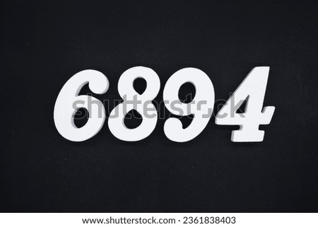 Black for the background. The number 6894 is made of white painted wood.