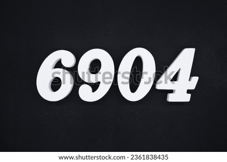 Black for the background. The number 6904 is made of white painted wood.