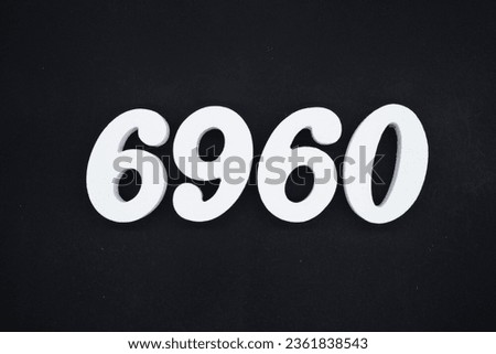 Black for the background. The number 6960 is made of white painted wood.